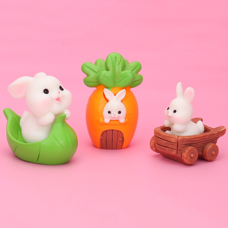 Five rabbit family carrot-leaf boat statues