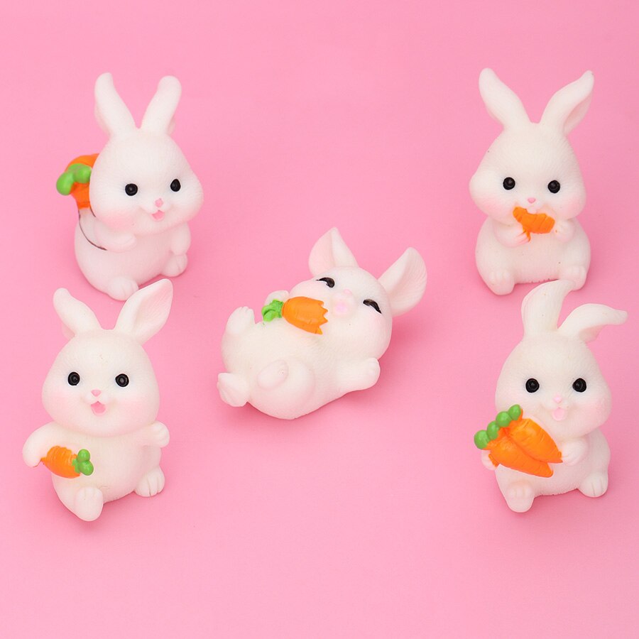 Five rabbit family carrot-leaf boat statues