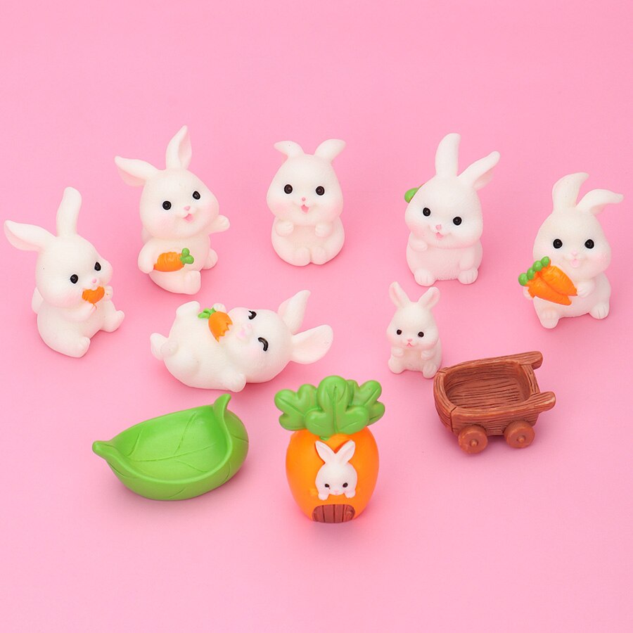 Five rabbit family carrot-leaf boat statues